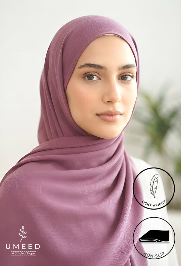 Elegant woman wearing a light weight, non-slip mauve hijab for modest fashion.