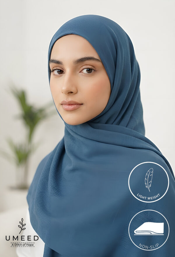 Elegant woman wearing a blue hijab with light weight and non-slip features.