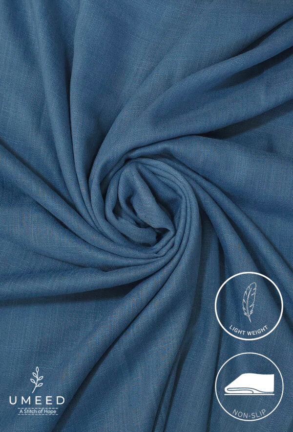 Lightweight blue fabric with a smooth texture and gentle drape.