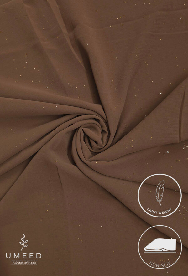 Lightweight, non-slip brown fabric with subtle gold specks for elegant fashion design.