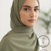 Elegant woman wearing a light weight, non-slip olive green hijab from Umeed Designs.