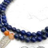 Handmade blue and orange beaded necklace with silver pendant from Umeed Designs.