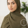 Elegant woman wearing olive green hijab with light weight and non-slip features.