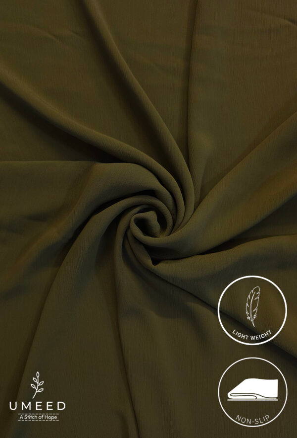 Lightweight, non-slip fabric in olive green for fashion and home decor.