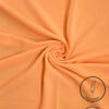 Peach-colored fabric with subtle glitter and light weight label from Umeed Designs.