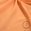Peach-colored lightweight, non-slip fabric with subtle glitter accents for elegant designs.