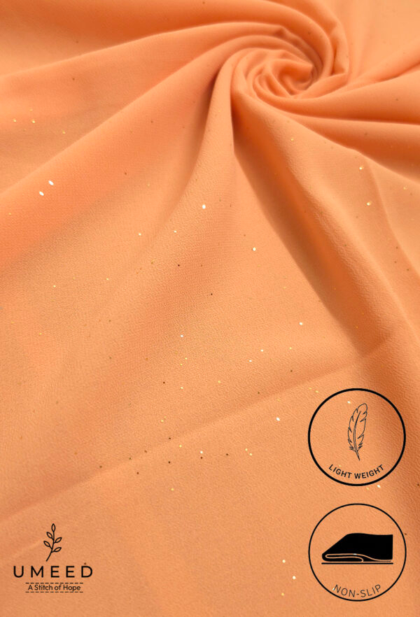 Peach-colored lightweight, non-slip fabric with subtle glitter accents for elegant designs.