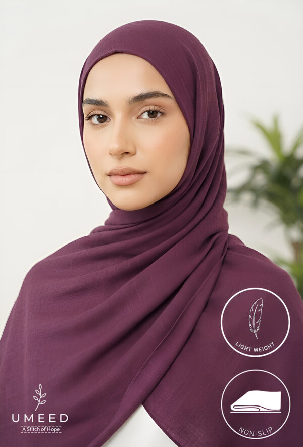 Elegant woman wearing a lightweight, non-slip maroon hijab from Umeed Designs.