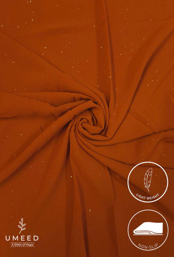 Lightweight, non-slip orange fabric with subtle glitter accents for fashion or decor.