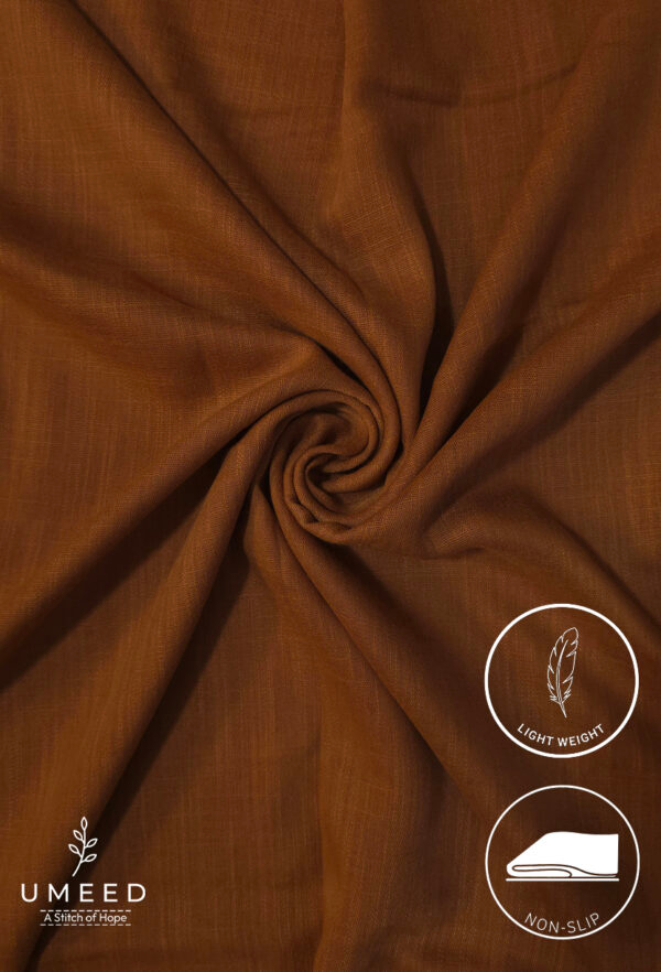 Lightweight, non-slip brown fabric from Umeed Designs for comfortable clothing.