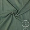 Lightweight green fabric with a smooth texture and subtle weave pattern.