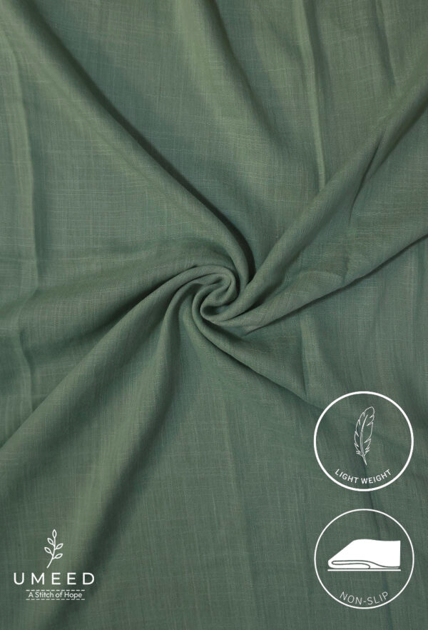 Lightweight green fabric with a smooth texture and subtle weave pattern.