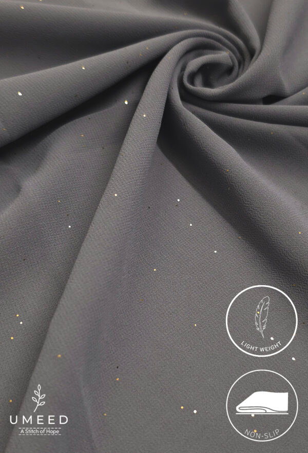 Gray fabric with small gold and silver glitter accents, lightweight and non-slip.