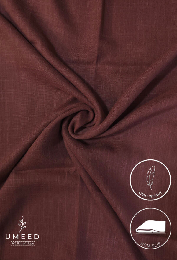 Lightweight, non-slip maroon fabric from Umeed Designs for elegant clothing.