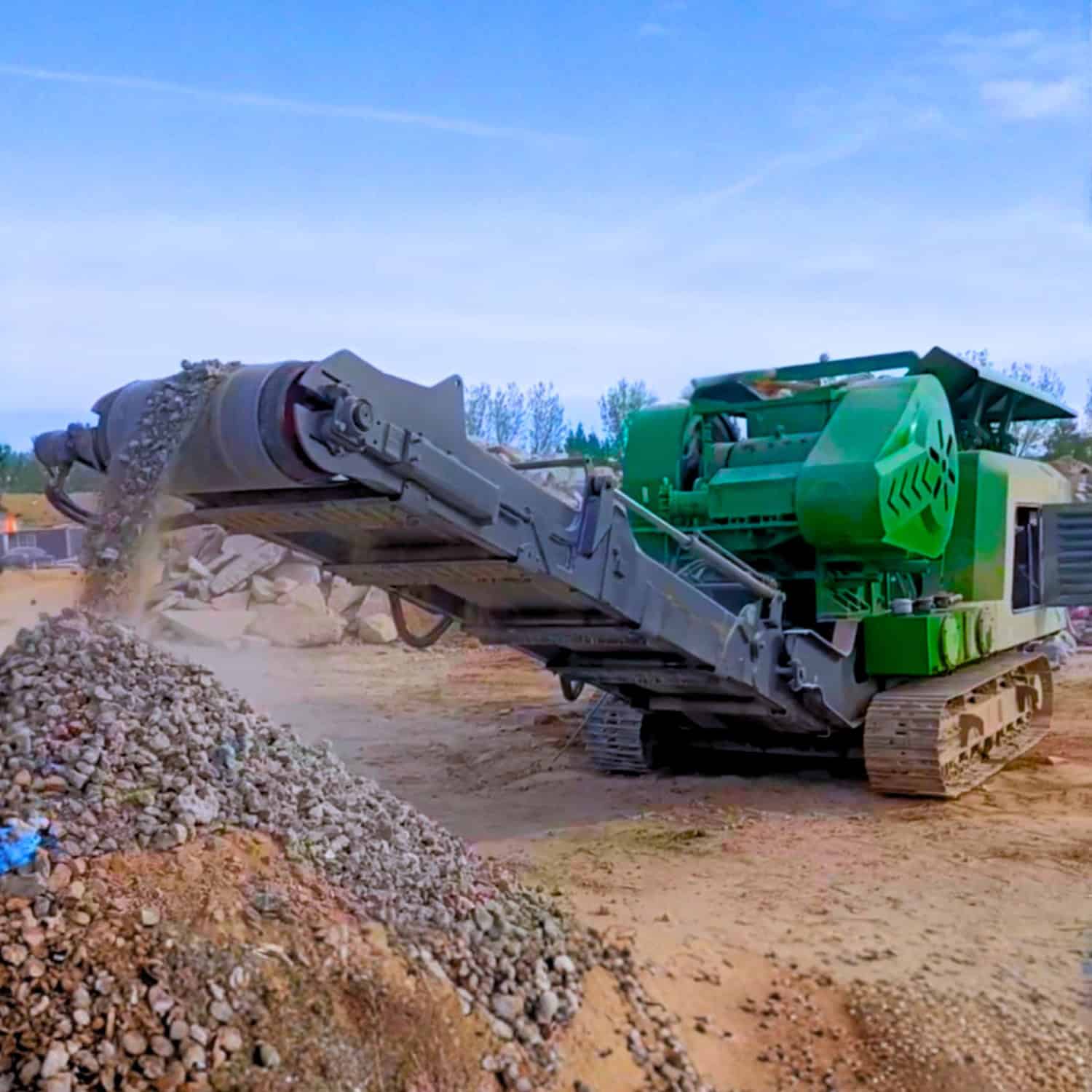 UPSEN 704 jaw crusher discharging crushed material on site.