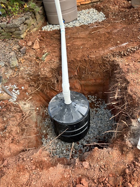 Dry well installation with stone-filled excavation at the UGA GSI demo site