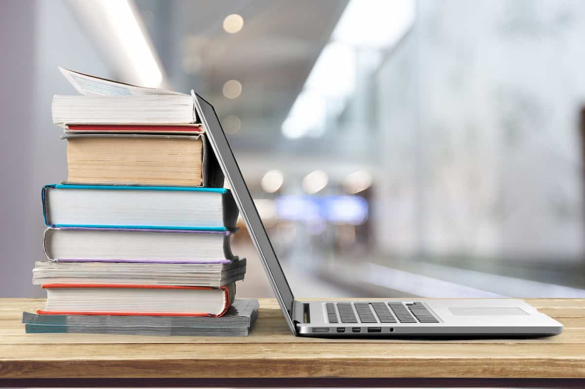 Laptop and some books on a desk