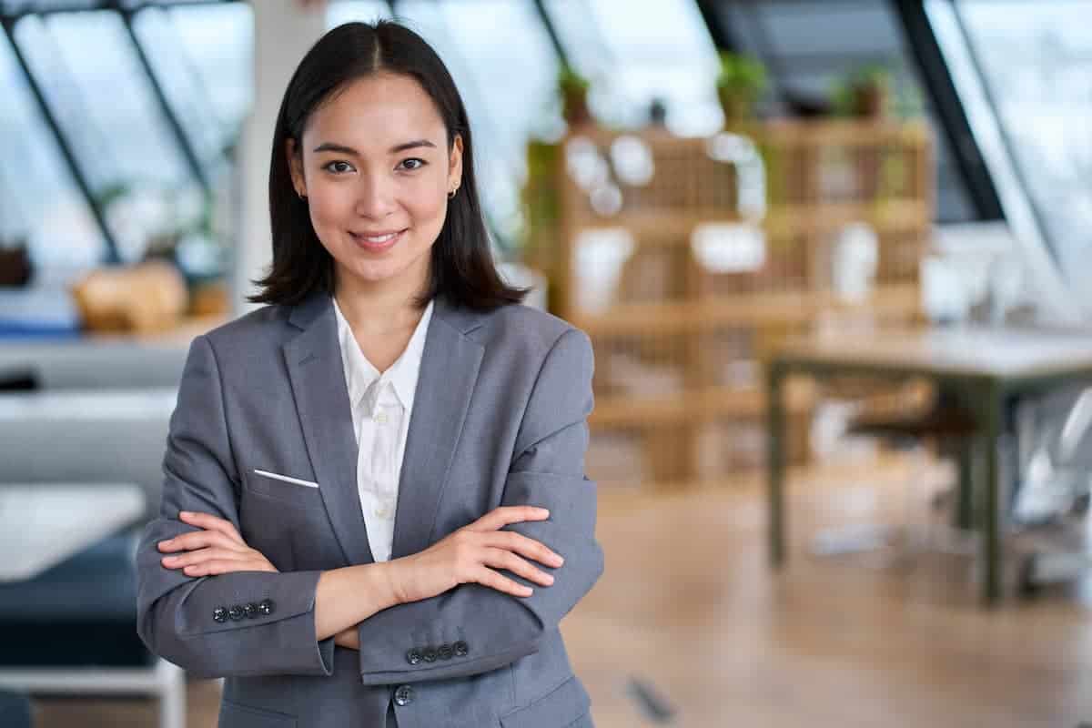 Business Woman standing with her arms crossed and smiling
