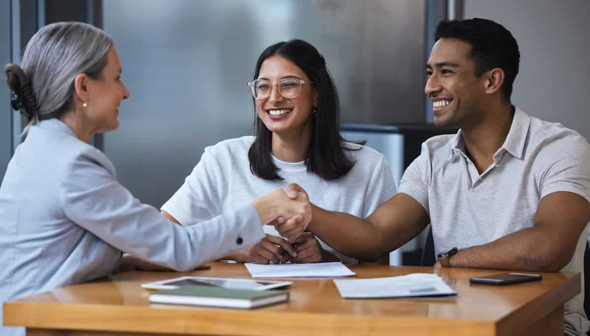 A young couple meeting with an insurance agent