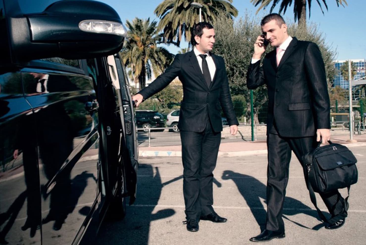 Professional chauffeur meeting guests at Budapest Airport for VIP pickup