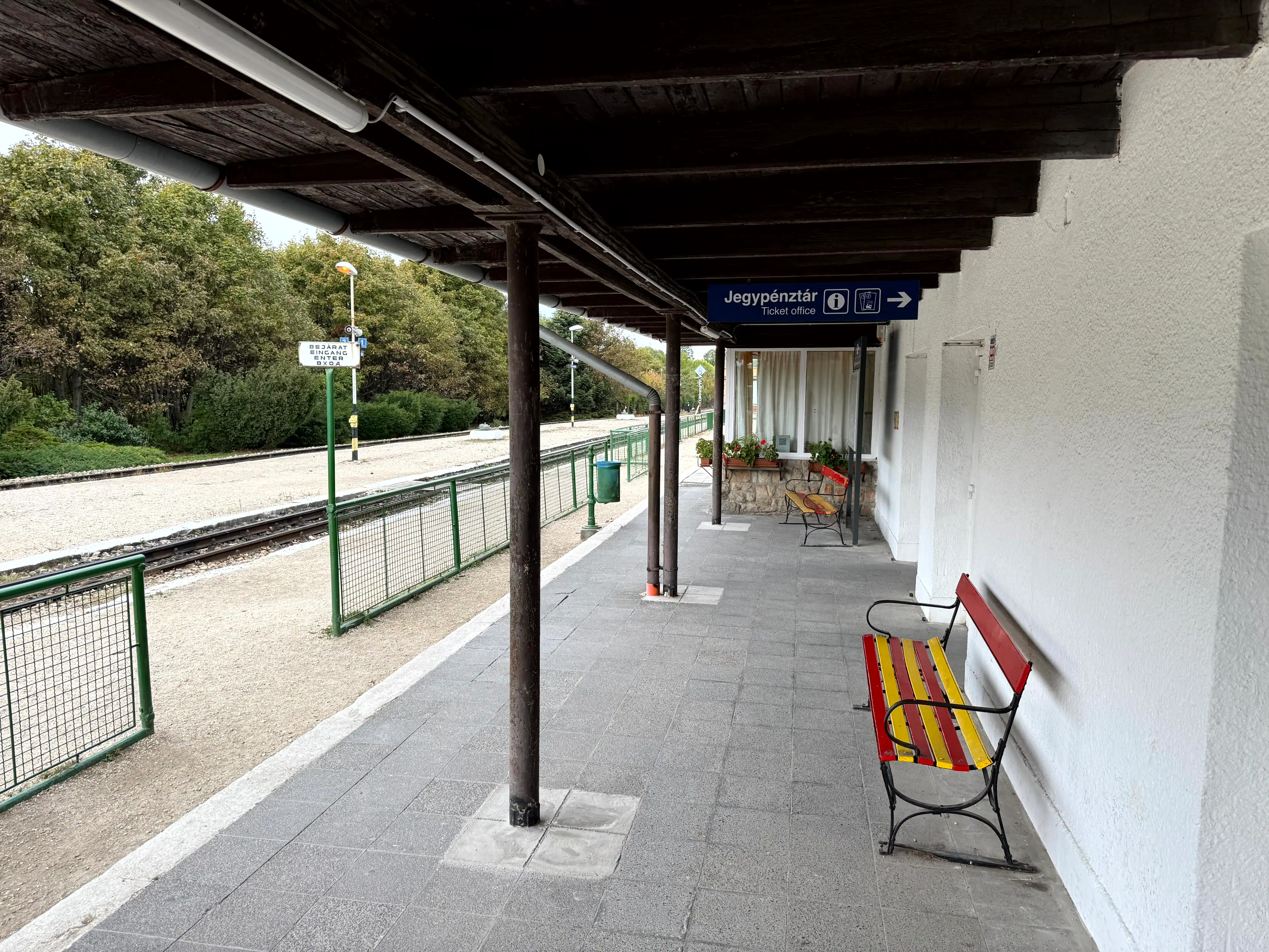 Train station platform with benches and shelter in Budapest, Hungary.