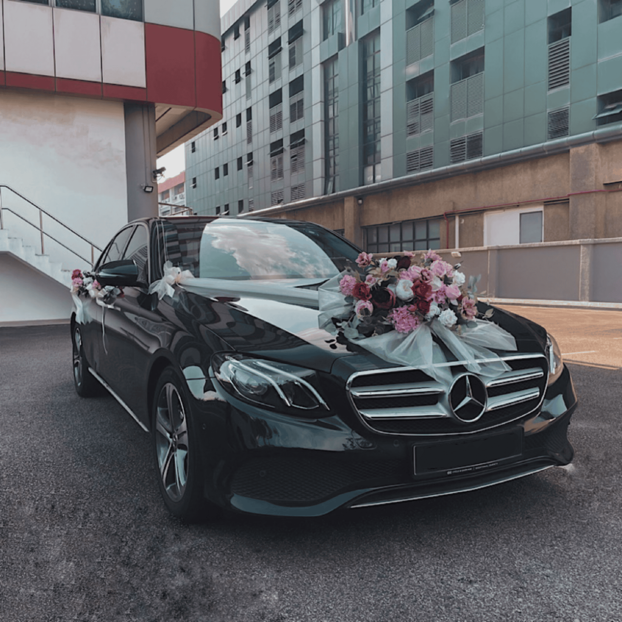 Benz wedding car with floral decorations for special event.
