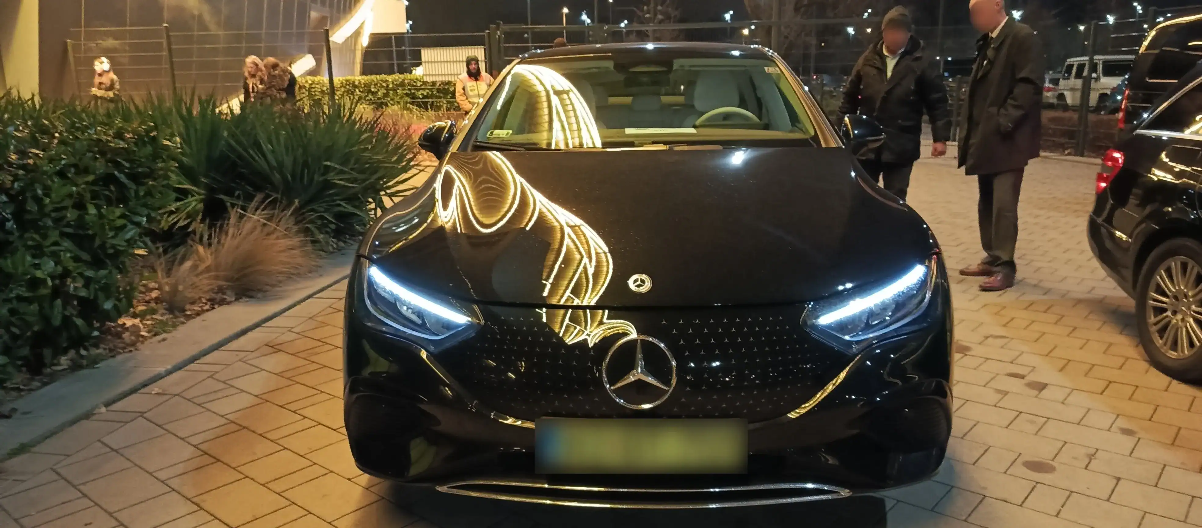 Benz car parked outdoors in Budapest at night.