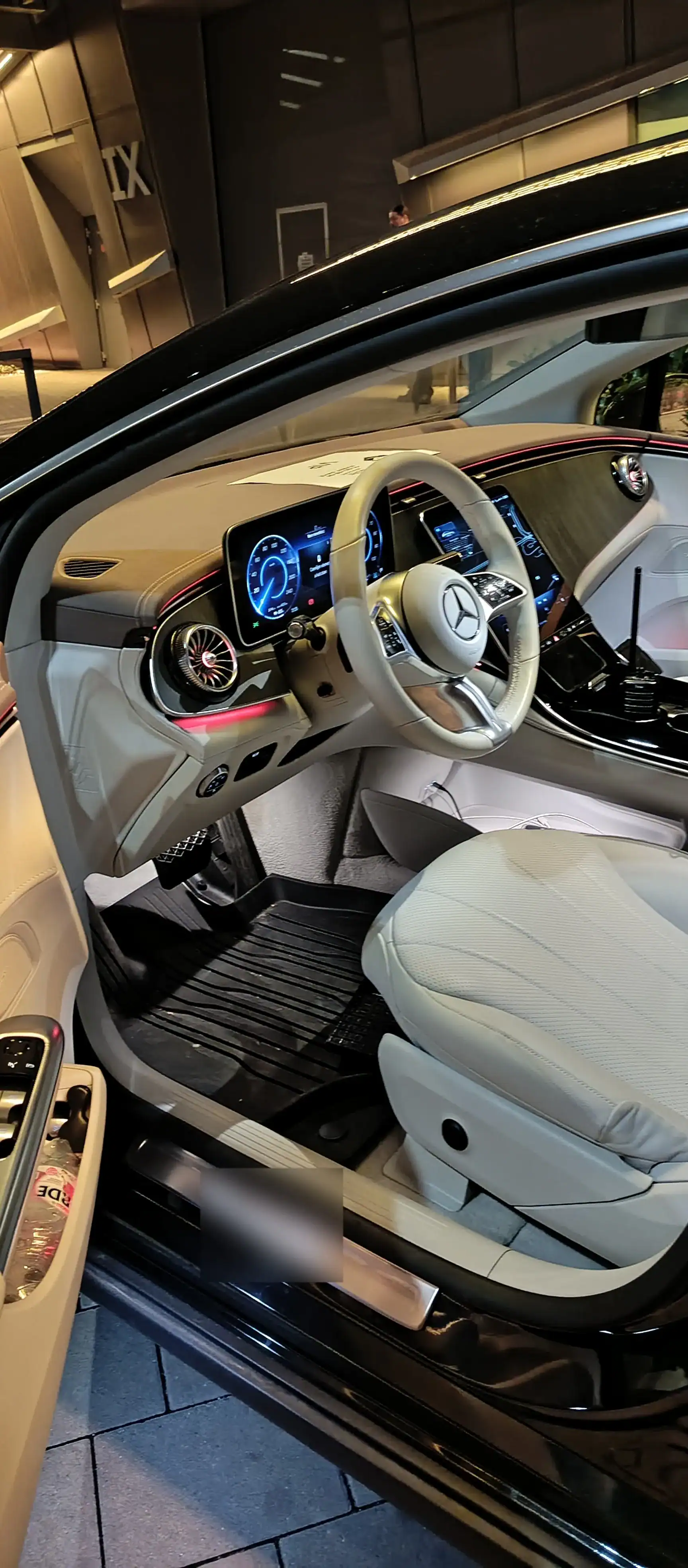 Benz car interior with modern dashboard and steering wheel for airport transfer.