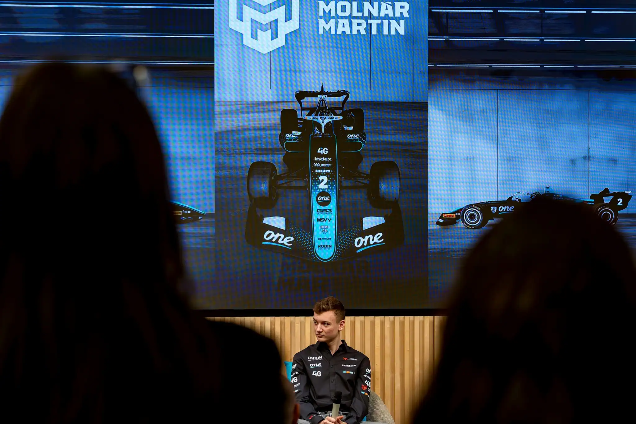 Martin Molnár's car racing through a corner at speed