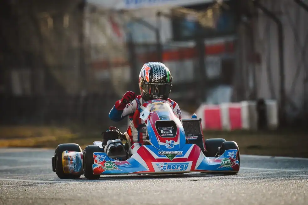 Martin Molnár's car at speed with sponsor livery