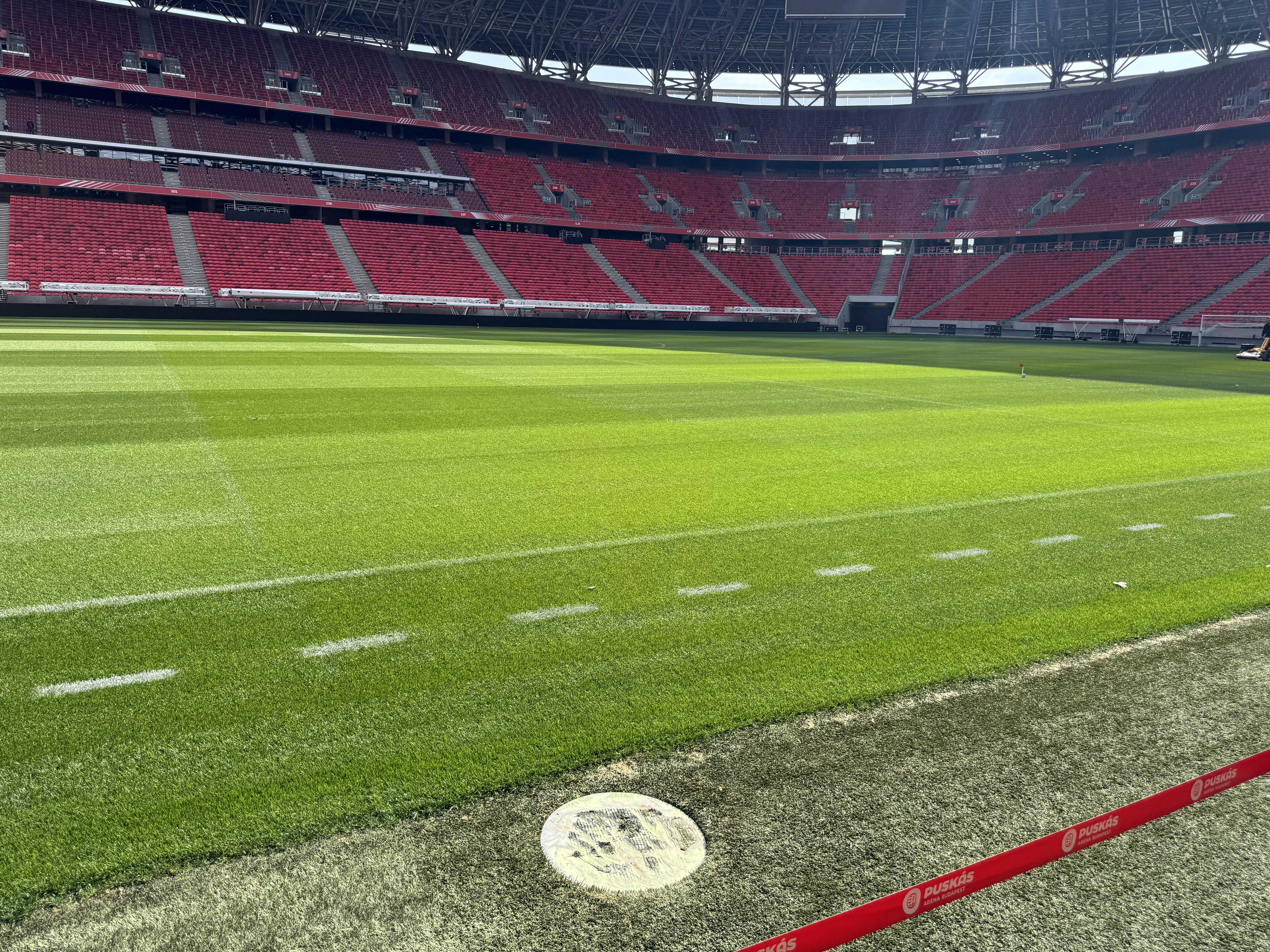 Close-up of stadium seating and the iconic Puskás crest
