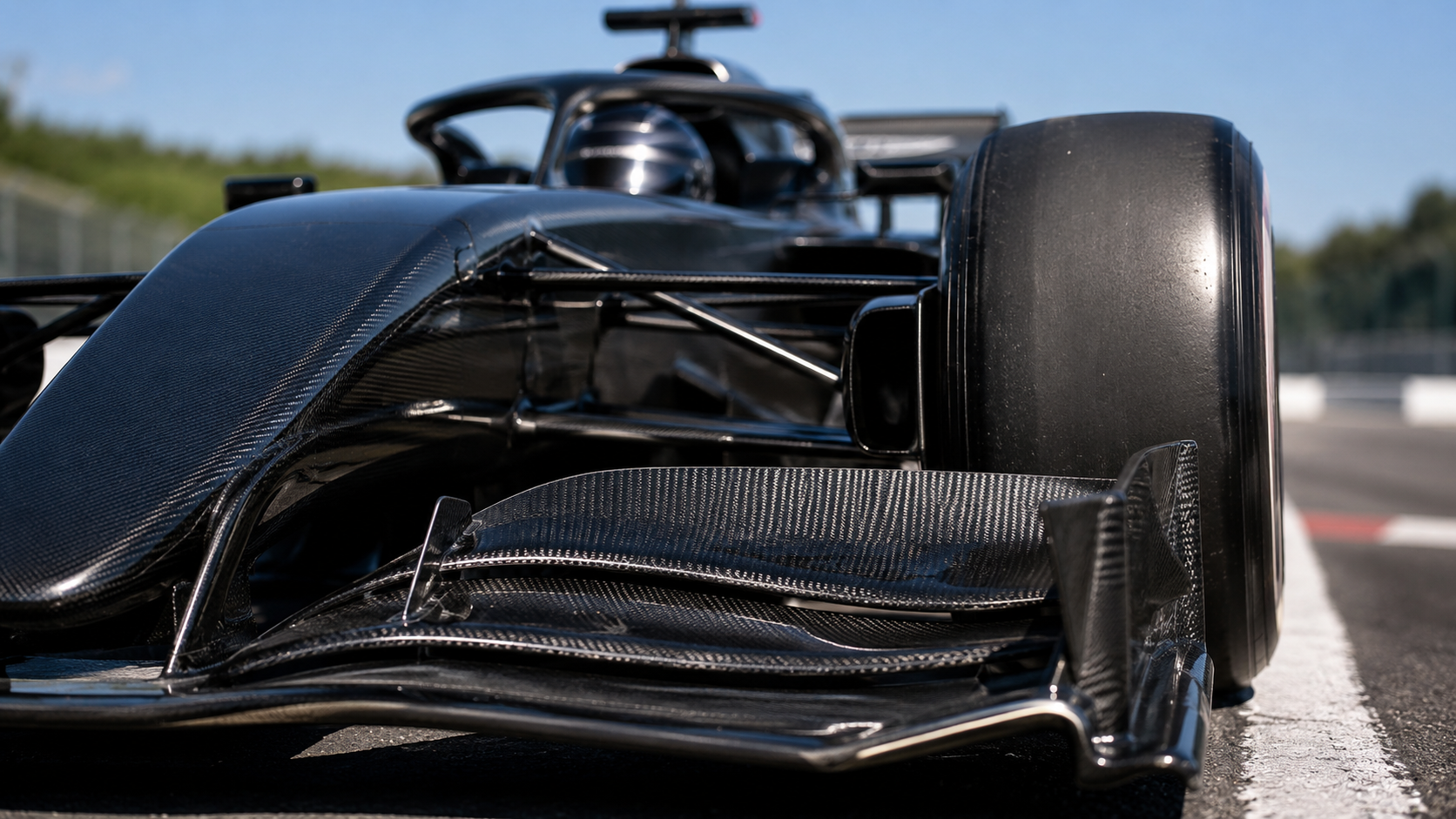 Close-up of a Formula 1 car front wing on track