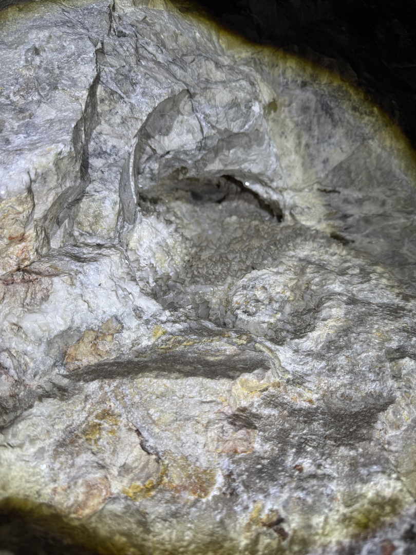 Pale walls studded with mineral detail
