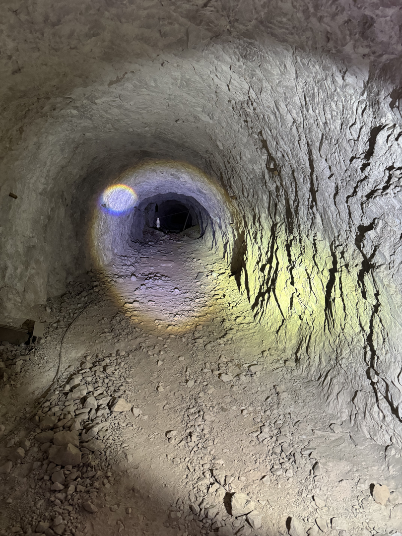 Deep into the passage, lamp ahead