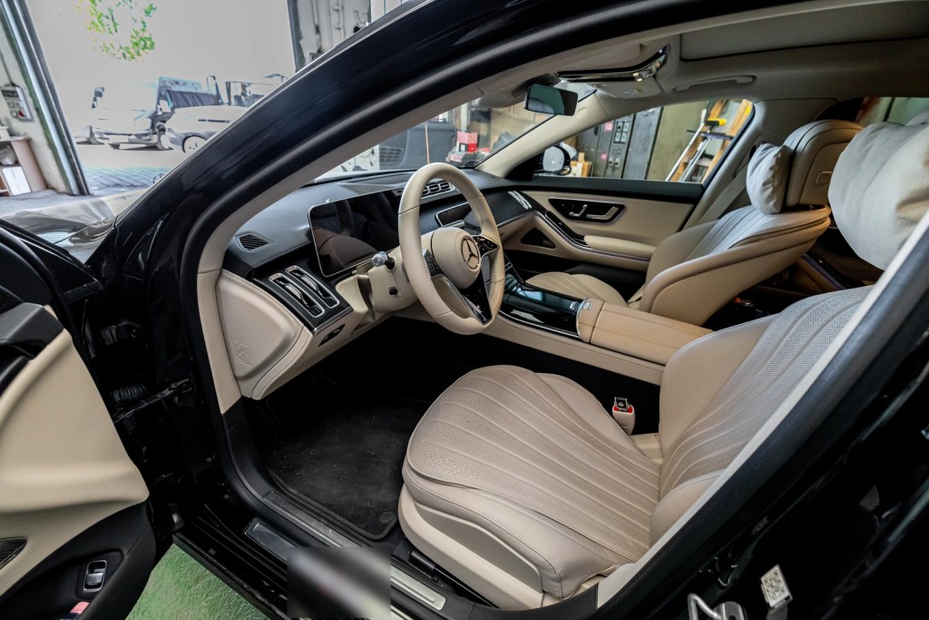 Cream leather cabin inside a Mercedes-Benz S-Class chauffeur car