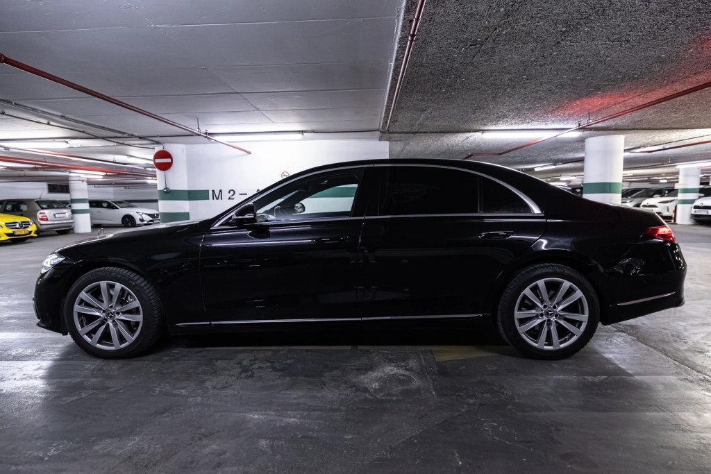 Black Mercedes-Benz S-Class sedan viewed from the side in the VanBudapest.com fleet garage