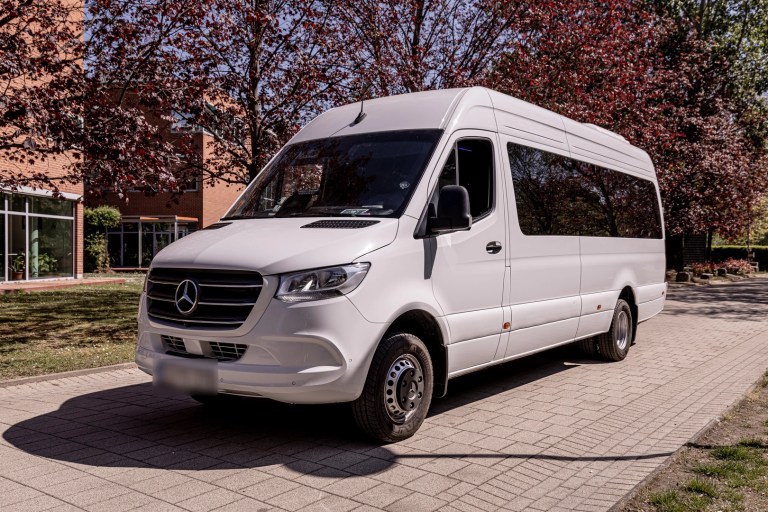 White Mercedes Sprinter minibus, front three-quarter view