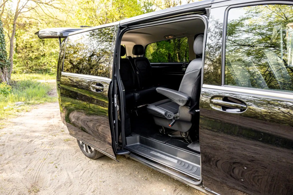 Black Mercedes V-Class with open sliding door ready for boarding