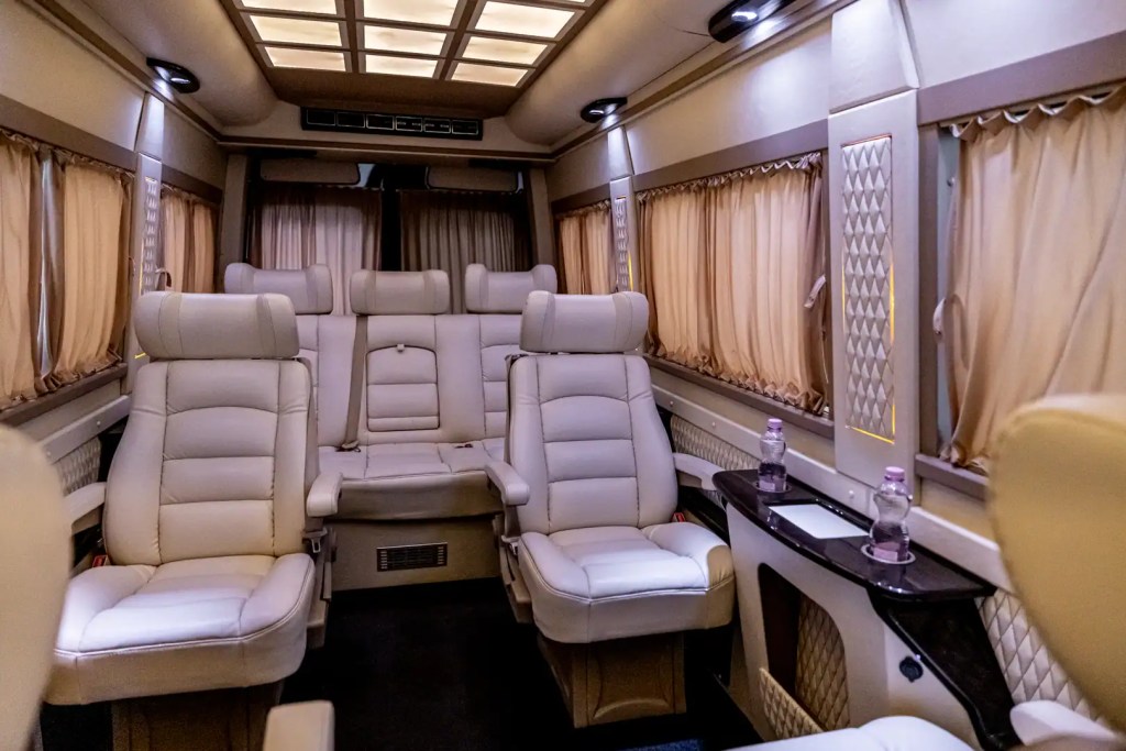 Beige leather passenger cabin inside a Mercedes-Benz VIP Sprinter