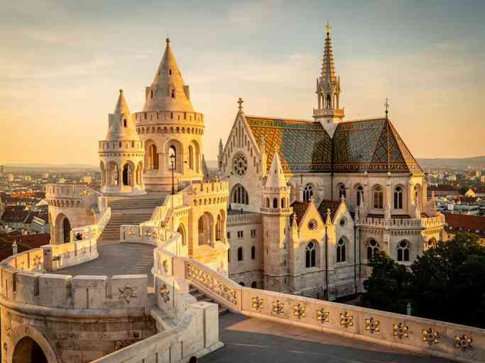 Fisherman's Bastion and Matthias Church in Budapest's historic Castle District at sunrise