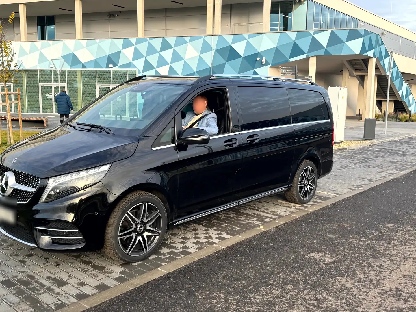 Black Mercedes V-Class arriving at an event venue