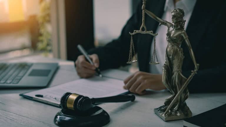 Legal professional with scales and gavel, representing securities law in California.