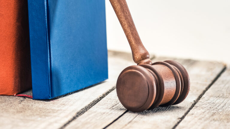 Investor meeting with a securities attorney to review brokerage statements and determine whether they have a legal claim against a financial advisor.