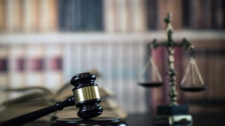 Concerned investor reviewing brokerage statements and investment performance with a securities attorney to identify possible financial advisor misconduct.