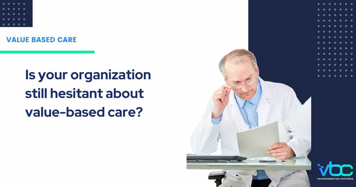 A doctor in a white coat reads documents at a desk next to text that questions whether organizations remain skeptical about value-based care strategies.