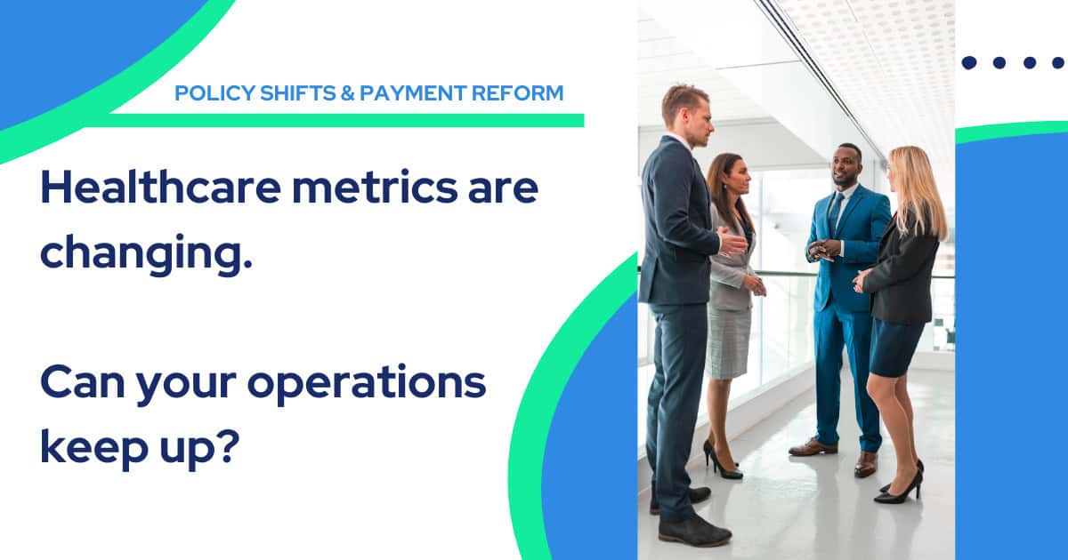 Four business professionals stand and talk Medicare quality measurement challenges across fragmented value-based care systems