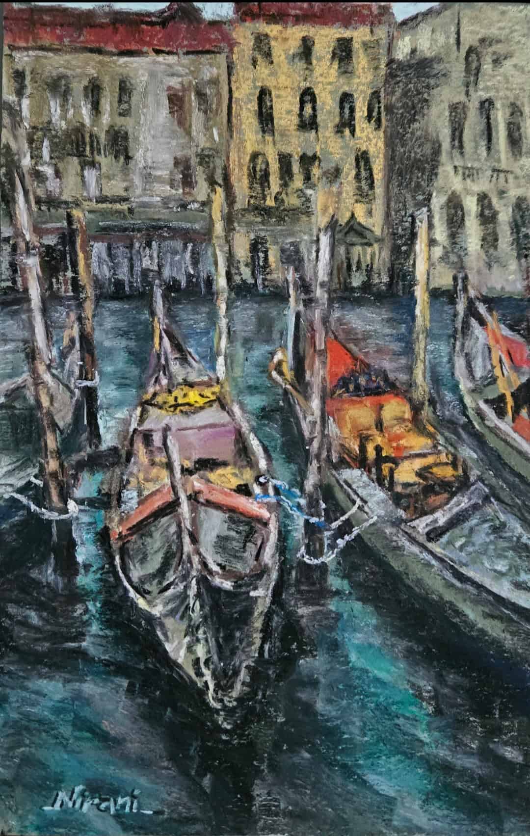 Gondolas docked along a Venetian canal with historic buildings in the background.