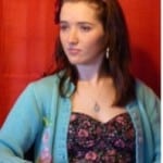 Portrait of a young woman representing the Pastel Society of Victoria, showcasing her pastel artwork.