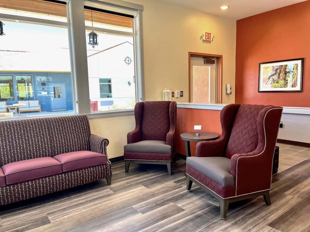 Comfortable seating with armchairs and a sofa in a welcoming lounge space.