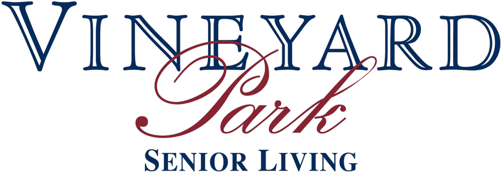 Vineyard Park Living entrance with lush landscaping and modern architecture.